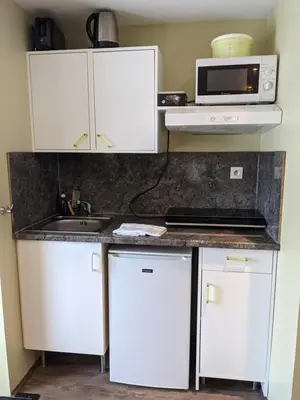 Cuisine ou kitchenette dans l'établissement Les gîtes de Cour Rémond