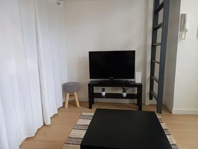 Télévision ou salle de divertissement dans l'établissement Studio avec terrasse en résidence calme à Dijon.