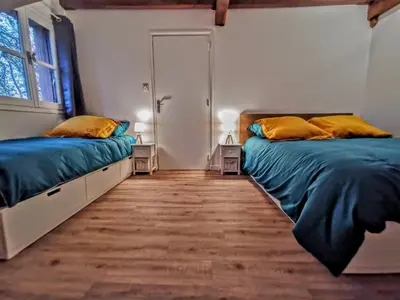 Un ou plusieurs lits dans un hébergement de l'établissement Moulin des Ducs by Vindihouses - Piscine chauffée - escalade - billard - fitness - etc