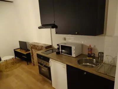 Cuisine ou kitchenette dans l'établissement Le Charmant Vannerie