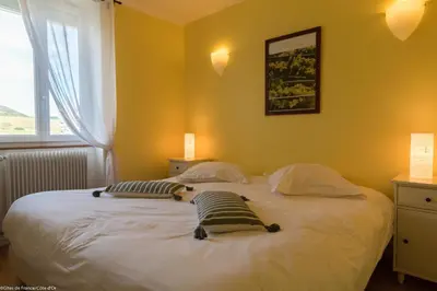 Un ou plusieurs lits dans un hébergement de l'établissement Les Meix sous le Château