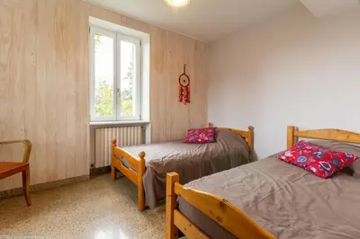 Un ou plusieurs lits dans un hébergement de l'établissement Gîte du Verger