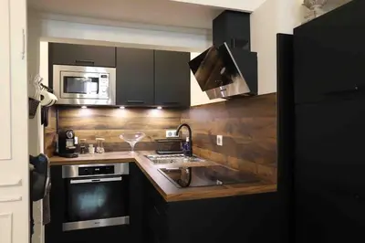 Cuisine ou kitchenette dans l'établissement L' ALCOVE- Confort Charme Downtown
