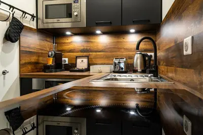 Cuisine ou kitchenette dans l'établissement L' ALCOVE- Confort Charme Downtown