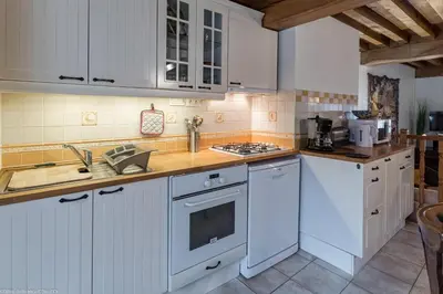 Cuisine ou kitchenette dans l'établissement La Maisonnette
