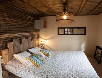 Un ou plusieurs lits dans un hébergement de l'établissement Gîte de l'Hôtel Dieu, en Bourgogne, avec SPA