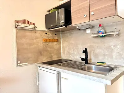 Cuisine ou kitchenette dans l'établissement Les Logis de Paray appartement n2