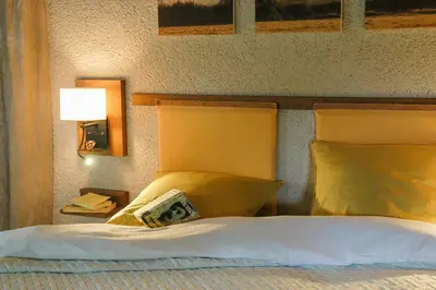 Un ou plusieurs lits dans un hébergement de l'établissement Au Grand Fête, B&B à la campagne