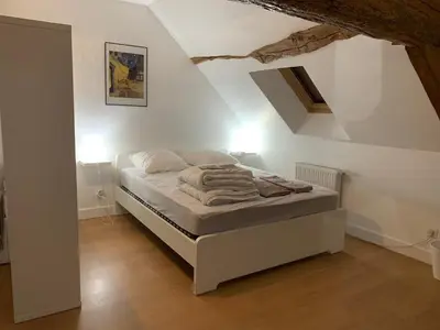 Un ou plusieurs lits dans un hébergement de l'établissement Gîte le cœur de Givry