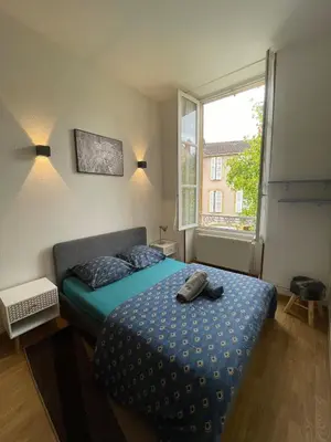 Un ou plusieurs lits dans un hébergement de l'établissement Appartement 6 personnes - Au coeur du centre ville