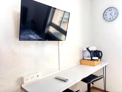 Télévision ou salle de divertissement dans l'établissement Les Logis de Paray Appartement 201