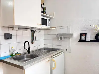 Cuisine ou kitchenette dans l'établissement Les Logis de Paray Appartement 201