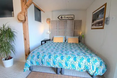 Un ou plusieurs lits dans un hébergement de l'établissement CABANA & Voie Bleue - Bord de Saône