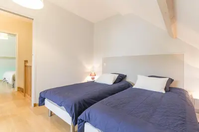 Un ou plusieurs lits dans un hébergement de l'établissement Maison Baduel