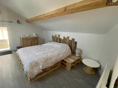 Un ou plusieurs lits dans un hébergement de l'établissement Chambre privative chez Toutoune