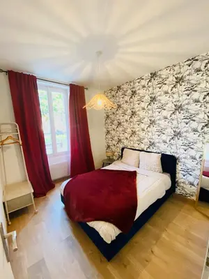 Un ou plusieurs lits dans un hébergement de l'établissement Charmant appartement Cité international - Gastronomie & Vin - Dijon