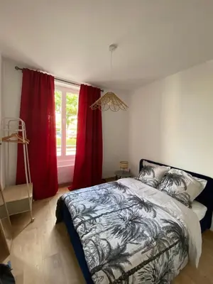 Un ou plusieurs lits dans un hébergement de l'établissement Charmant appartement Cité international - Gastronomie & Vin - Dijon