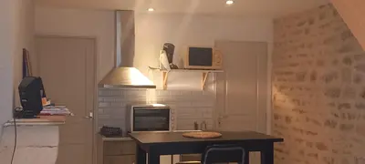 Télévision ou salle de divertissement dans l'établissement Le cottage du village