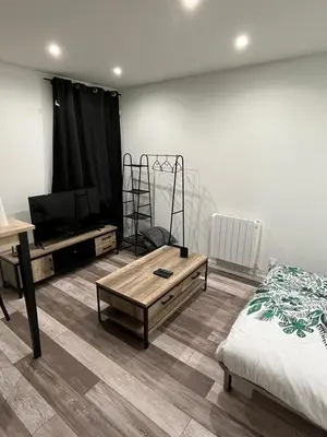 Un ou plusieurs lits dans un hébergement de l'établissement Superbe appartement avec parking gratuit sur place