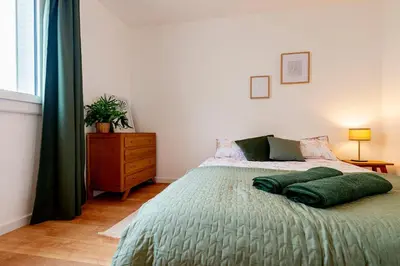 Un ou plusieurs lits dans un hébergement de l'établissement Le Jouvence Cozy - Confort - Zen - Parking gratuit