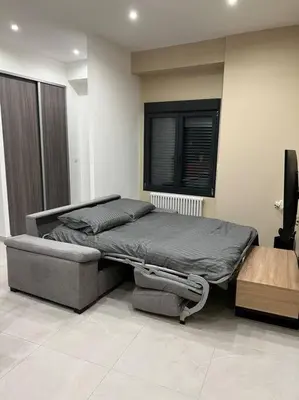 Un ou plusieurs lits dans un hébergement de l'établissement Belle appartement avec parking gratuit
