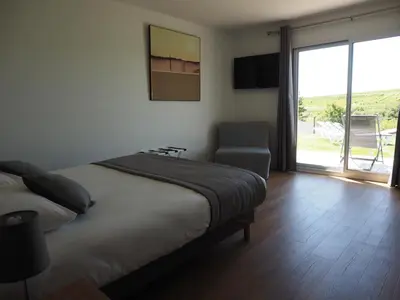 Un ou plusieurs lits dans un hébergement de l'établissement Les Lodges du Revermont