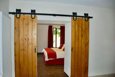 Un ou plusieurs lits dans un hébergement de l'établissement Maison de la Tour