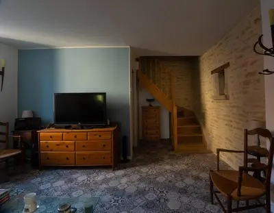 Télévision ou salle de divertissement dans l'établissement Au Pont Vert