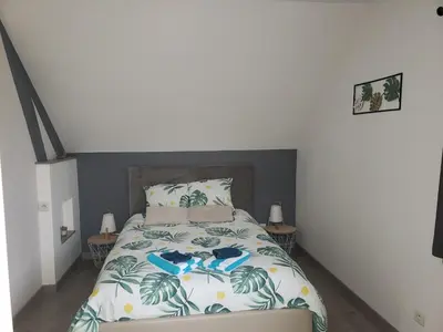 Un ou plusieurs lits dans un hébergement de l'établissement Le charmillon, Appartement cosi avec double garage
