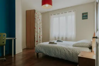 Un ou plusieurs lits dans un hébergement de l'établissement L'Orgelétaine : Grande Maison au milieu des Lacs du Jura
