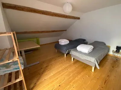 Un ou plusieurs lits dans un hébergement de l'établissement Gîte de la tour de Paradis