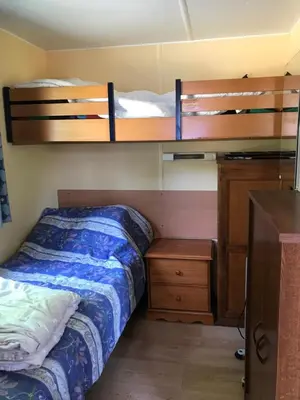 Un ou plusieurs lits dans un hébergement de l'établissement Mobil Home à la ferme