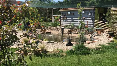 Jardin de l'établissement Gîtes L'Art d'une Pause