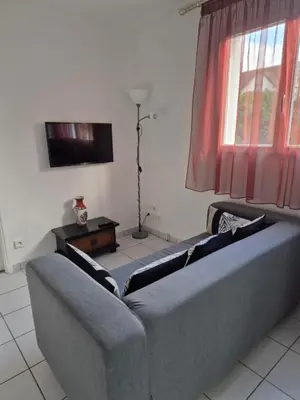 Télévision ou salle de divertissement dans l'établissement Chambre Is