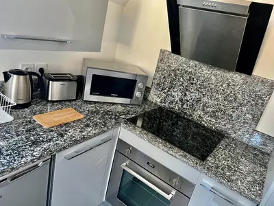 Cuisine ou kitchenette dans l'établissement Le P'tit Charmant : centre historique de Dijon
