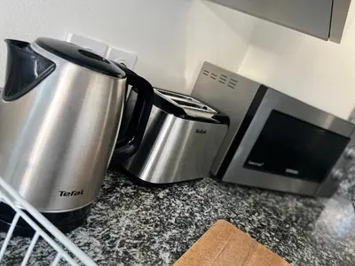 Cuisine ou kitchenette dans l'établissement Le P'tit Charmant : centre historique de Dijon