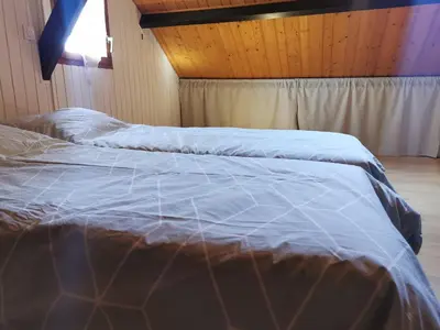 Un ou plusieurs lits dans un hébergement de l'établissement Studio Duplex avec jardin - La voie des Salines