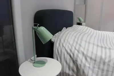 Un ou plusieurs lits dans un hébergement de l'établissement joli 2 pièces avec cour privée