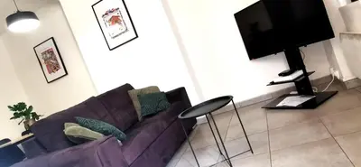 Télévision ou salle de divertissement dans l'établissement Appartement en plein coeur de Mâcon H
