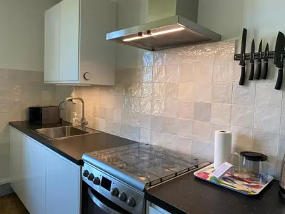 Cuisine ou kitchenette dans l'établissement Fleurs au Bourg