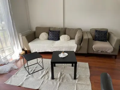 Coin salon dans l'établissement Appartement 2 chambres avec parking privé gratuit