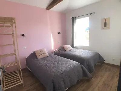 Un ou plusieurs lits dans un hébergement de l'établissement Gîte Raisin Rose