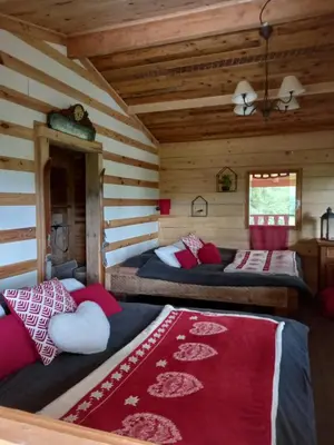Un ou plusieurs lits dans un hébergement de l'établissement Chalet cocooning pleine nature