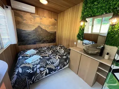 Un ou plusieurs lits dans un hébergement de l'établissement La Cabane Du Champ Du Possible