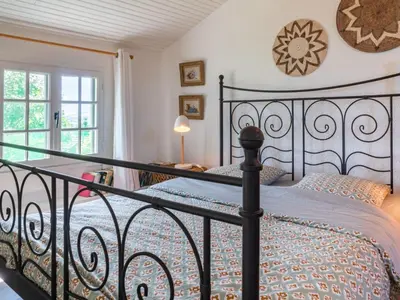 Un ou plusieurs lits dans un hébergement de l'établissement Holiday Home Le Glaude by Interhome