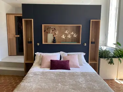 Un ou plusieurs lits dans un hébergement de l'établissement Suite avec Spa Quartier Cathédrale