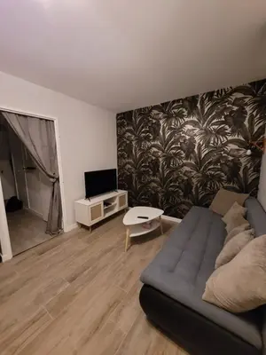 Télévision ou salle de divertissement dans l'établissement Quartier République avec terrasse
