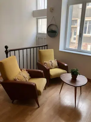 Coin salon dans l'établissement Appartement en duplex à Auxonne