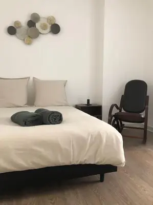 Un ou plusieurs lits dans un hébergement de l'établissement Appartement en duplex à Auxonne