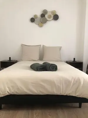 Un ou plusieurs lits dans un hébergement de l'établissement Appartement en duplex à Auxonne